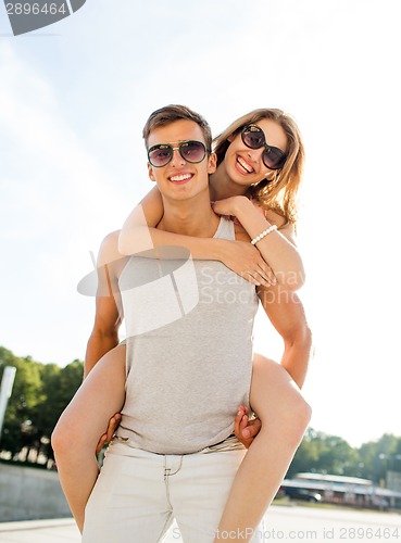 Image of smiling couple having fun in city