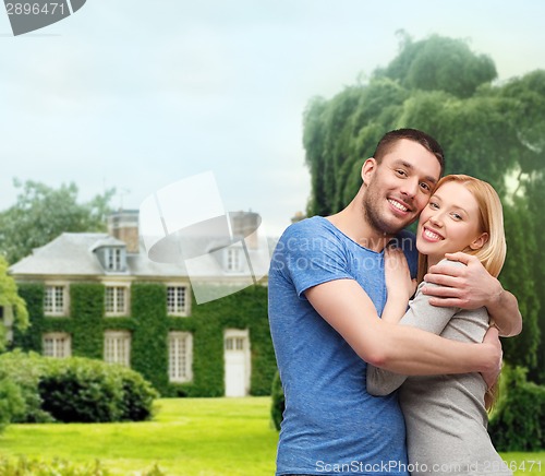 Image of smiling couple hugging