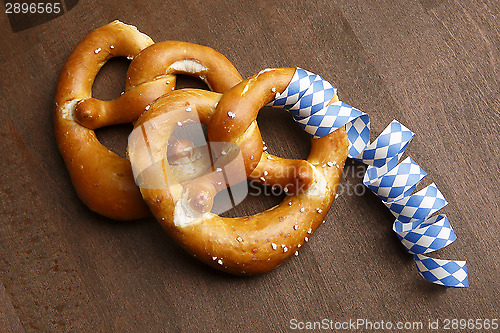 Image of Two typical bavarian pretzel with white and blue streamer