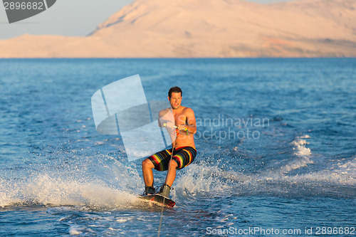 Image of Wakeboarder in sunset.