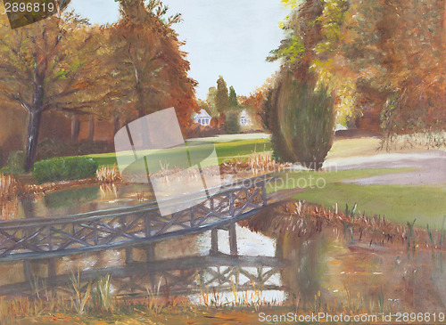 Image of Autumn forest with a pond and bridge over the pond