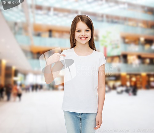 Image of smiling little girl in white blank t-shirt