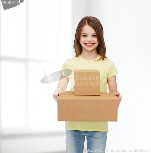 Image of smiling little girl in white blank t-shirt