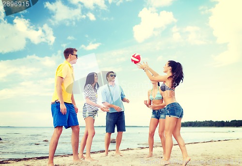 Image of group of friends having fun on the beach