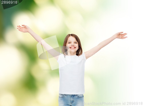 Image of smiling little girl in white blank t-shirt