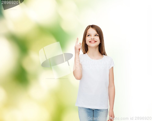 Image of smiling little girl in white blank t-shirt