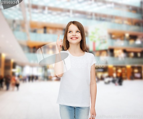 Image of smiling little girl in white blank t-shirt