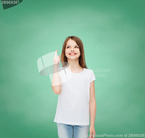 Image of smiling little girl in white blank t-shirt