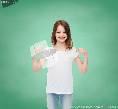 Image of smiling little girl in white blank t-shirt