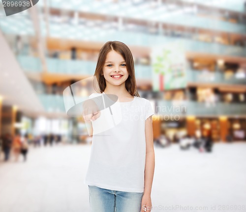 Image of smiling little girl in white blank t-shirt