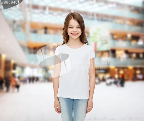 Image of smiling little girl in white blank t-shirt