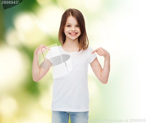 Image of smiling little girl in white blank t-shirt