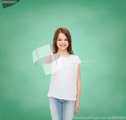 Image of smiling little girl in white blank t-shirt
