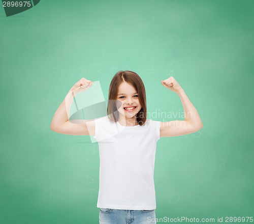 Image of smiling little girl in white blank t-shirt