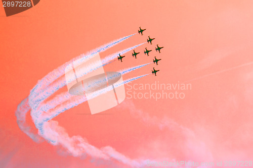Image of arircraft show on the blue sky