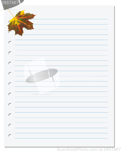 Image of Notebook paper with autumn maple leaf in corner