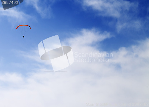 Image of Silhouette of skydiver at sky