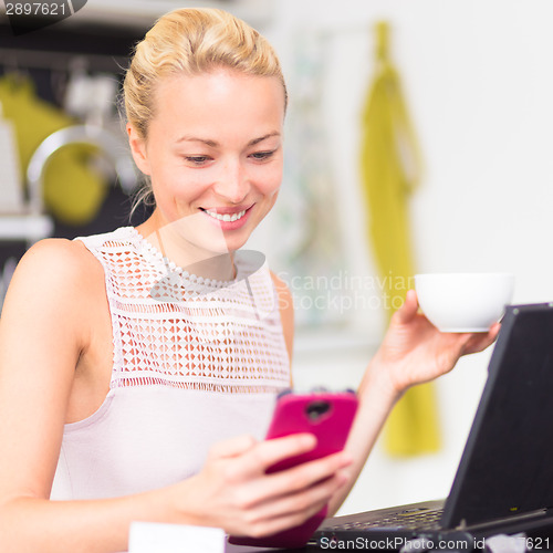 Image of Business woman working from home.