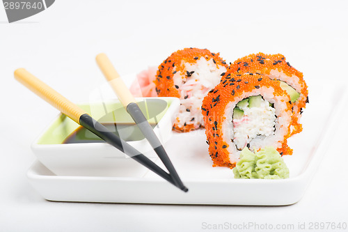 Image of Chopsticks and sushi on the plate