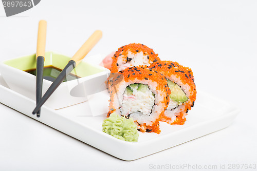 Image of Sushi rolls with caviar on the plate