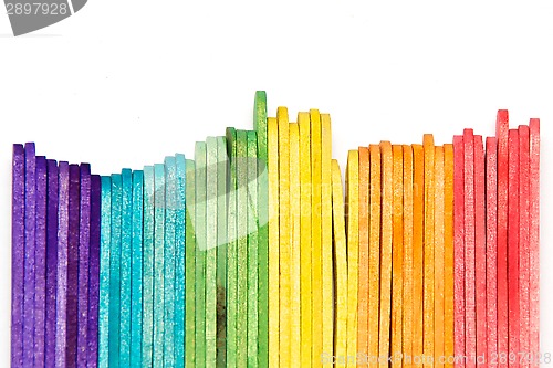 Image of rainbow popsicle sticks on edge