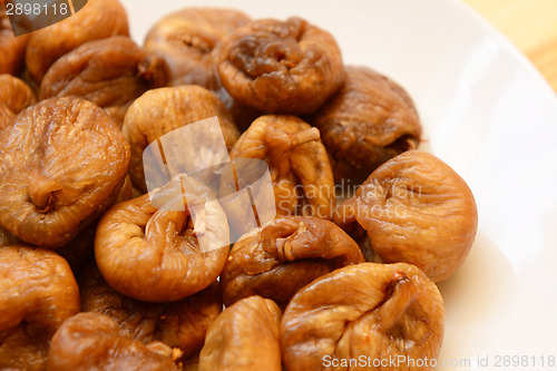 Image of Soft dried figs on a white plate