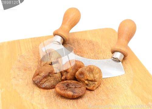 Image of Whole soft dried figs with a rocking knife 