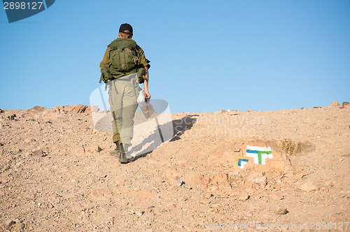 Image of Soldiers patrol in desert