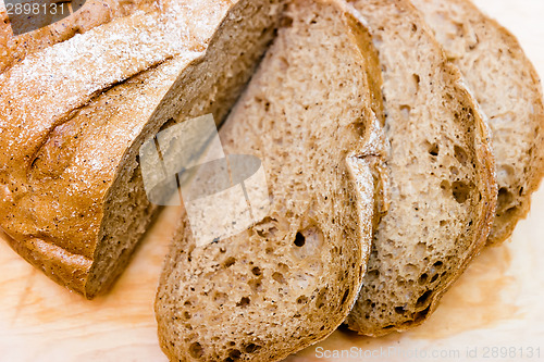 Image of Sliced rye bread on a wooden board