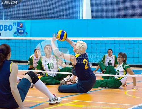 Image of RUSSIA, MOSCOW - MAY 11: Angela Churkina (2) atack on International Sitting volleyball tournament game Ukraine vs Brazil on May 11, 2014, in Moscow, stadium CSP Izmailovo, Russia