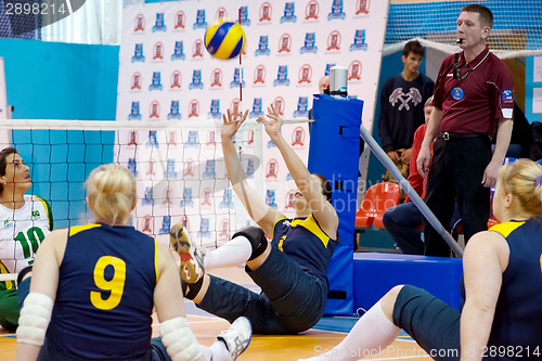 Image of RUSSIA, MOSCOW - MAY 11: Angela Churkina (2) atack on International Sitting volleyball tournament game Ukraine vs Brazil on May 11, 2014, in Moscow, stadium CSP Izmailovo, Russia