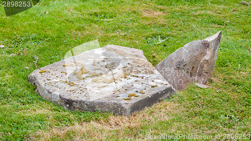 Image of Very old broken gravestone in the cemetery