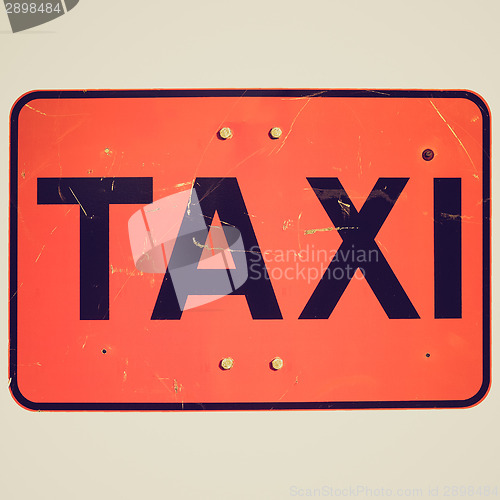 Image of Retro look Taxi sign isolated