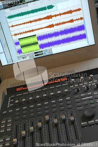 Image of Professional audio mixer with sliders and sound waves