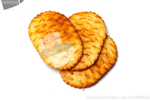 Image of three oval biscuits over white