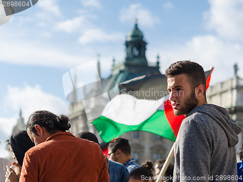 Image of Face of a young activist on the background of the Palestinian fl