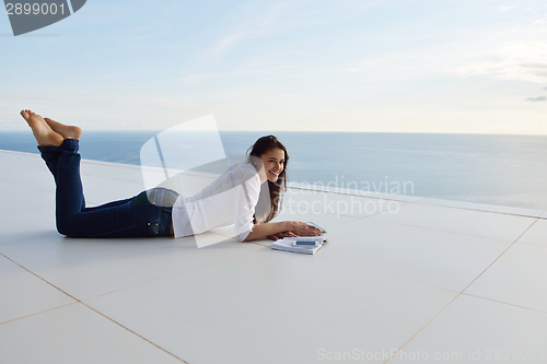 Image of relaxed young womant at home