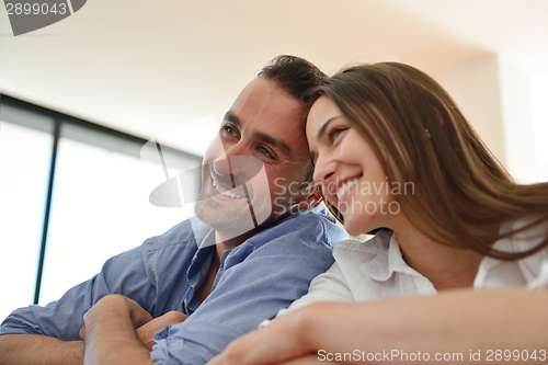 Image of relaxed young couple at home