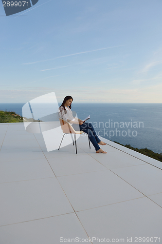 Image of relaxed young womant at home