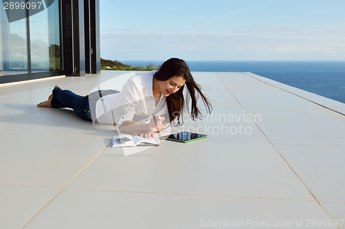 Image of relaxed young womant at home
