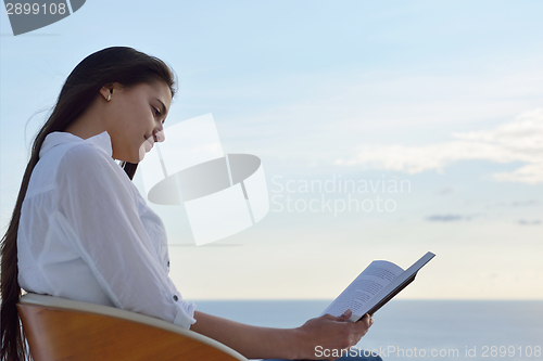 Image of relaxed young womant at home