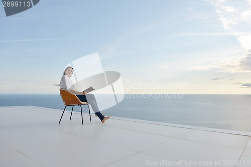 Image of relaxed young womant at home