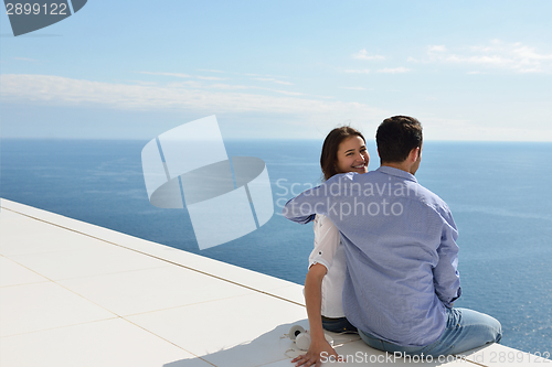 Image of relaxed young couple at home