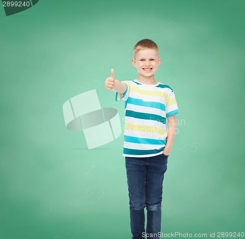 Image of little boy in casual clothes with arms crossed