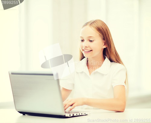 Image of girl with laptop pc at school