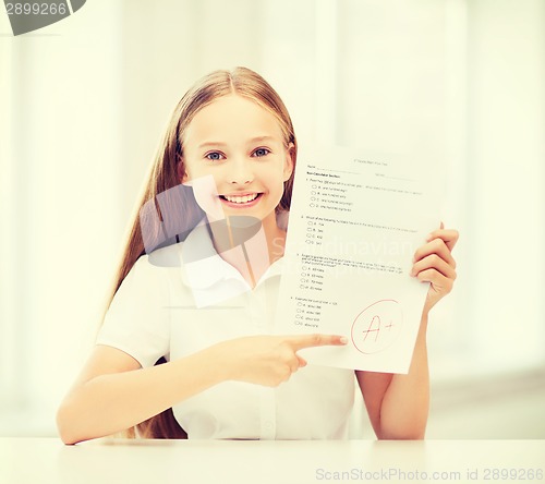 Image of girl with test and grade at school