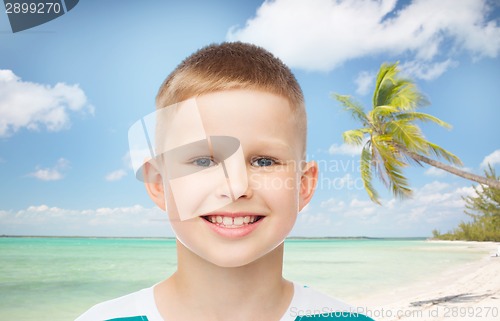 Image of smiling little boy over green background