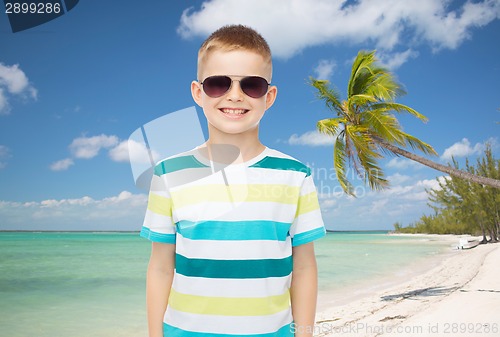 Image of smiling little boy over green background