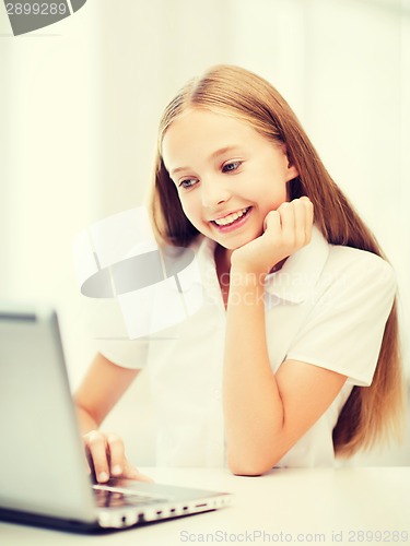Image of girl with laptop pc at school