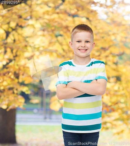 Image of little boy in casual clothes with arms crossed